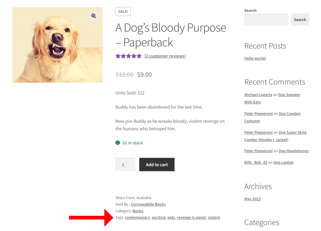 A screencap of the marketplace frontend, revealing a product listing of a book called "A Dog's Bloody Purpose," complete with an image of a snarling yellow dog, and a big red arrow pointing to the WooCommerce product tags